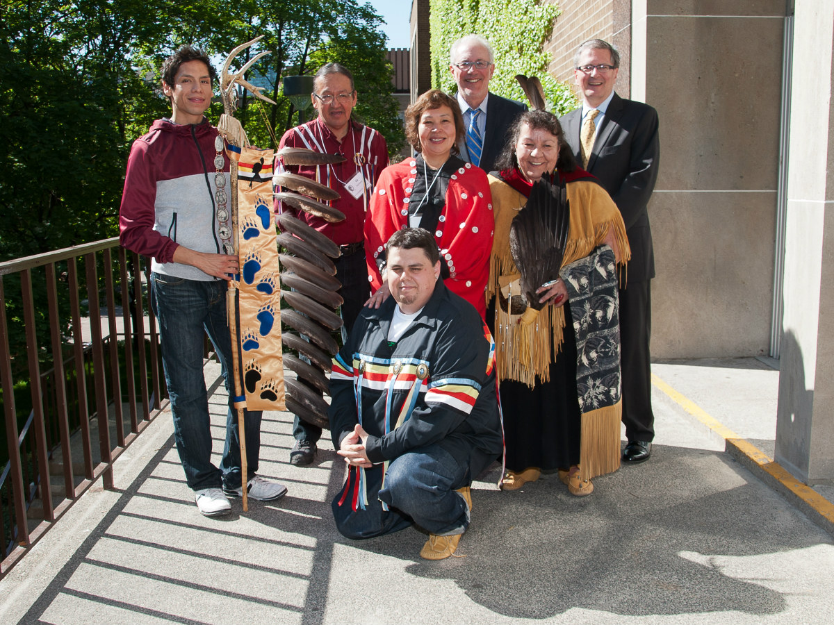 Members of TMU Aboriginal Student Services and former Toronto Metropolitan University president Sheldon Levy pose with ceremonial Eagle Staff in May 2012.