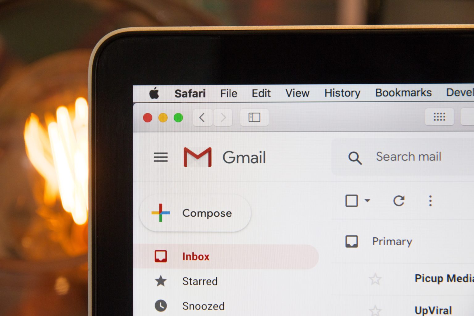 A MacBook screen showing a gmail inbox 
