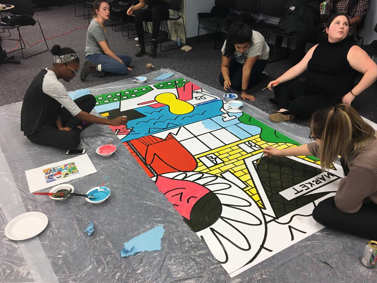 Students painting a mural