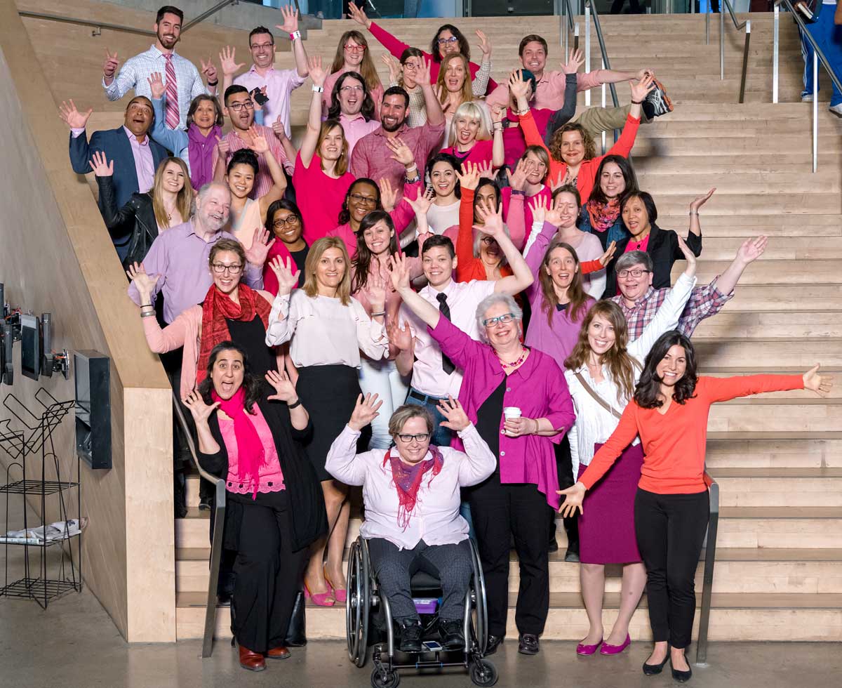 Community members dressed in pink on SLC stairs