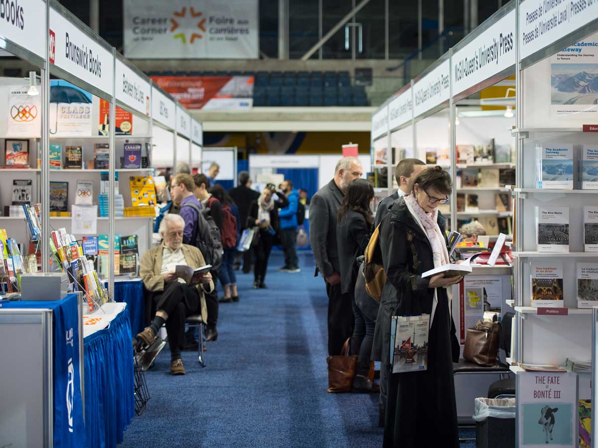 People at the Congress Expo, reading at booths