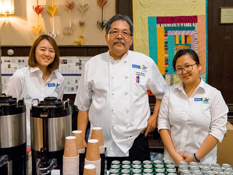 Chef Paul Huange, middle, with two female students
