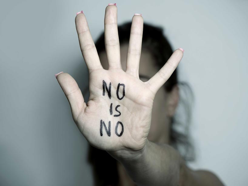 Hand with writing on it that says ‘no is no’