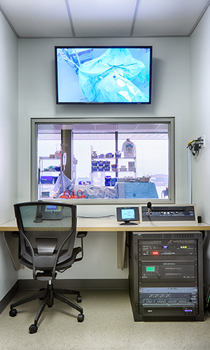 Student nursing lab for with televsion screen displaying an operating table.