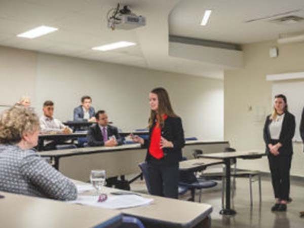 A team delivers their pitch to a team of judges at the Ted Rogers Leaders Centre's ethical case competition last year.