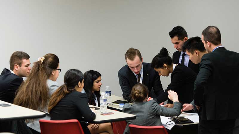 Group of students discussing a project at a table
