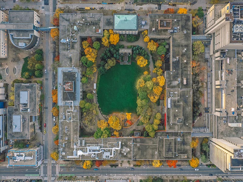 Our university's quad from an aerial perspective. The green grass and orange trees are framed by the Kerr Quad building.