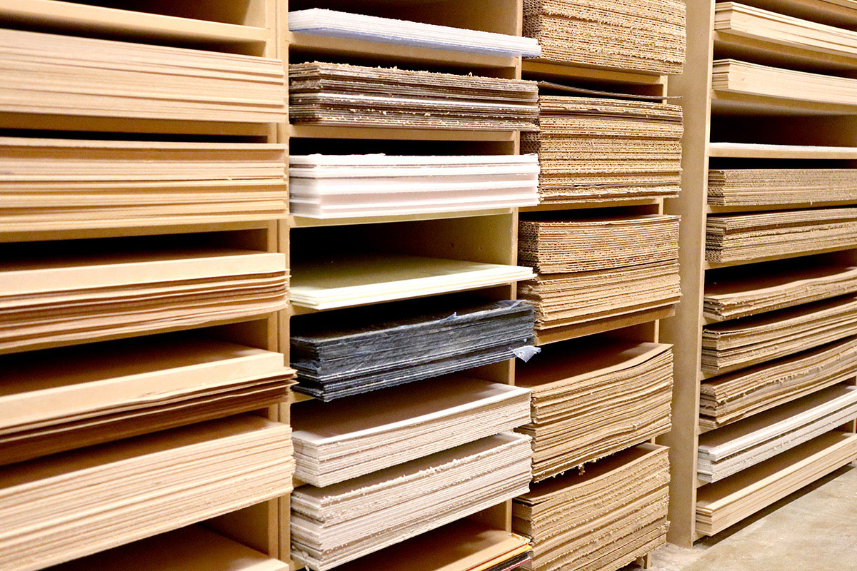 A close-up of various types of papers, cardboard, wood sheets and other materials for making architectural models.