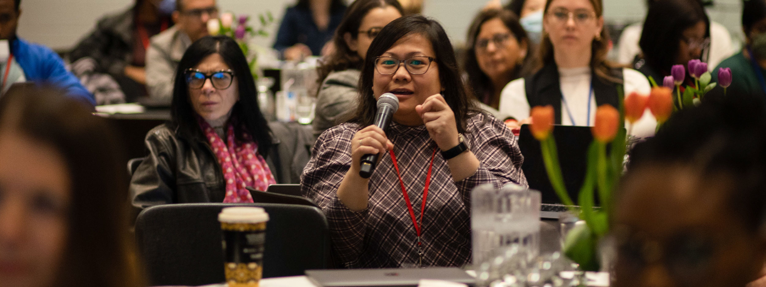 Image of stipend student Rica Agnes Castaneda speaking at a conference