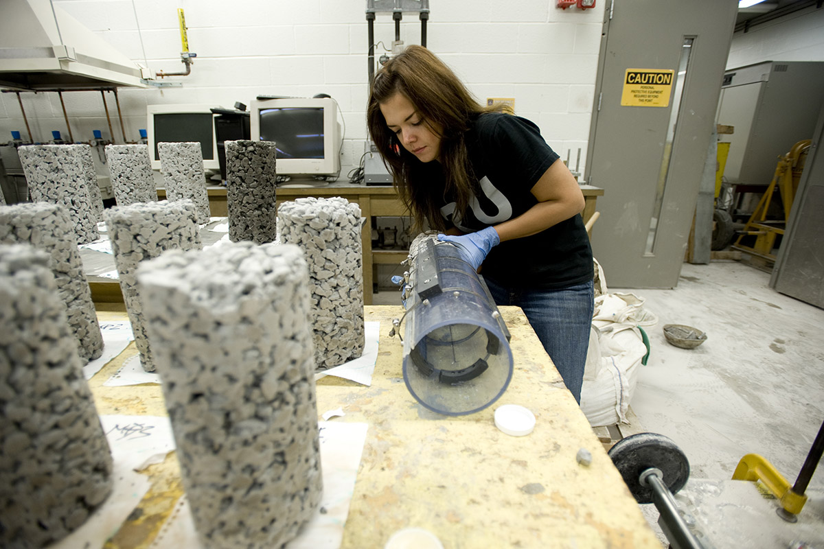 Civil engineering graduate student conducting research in a civil lab