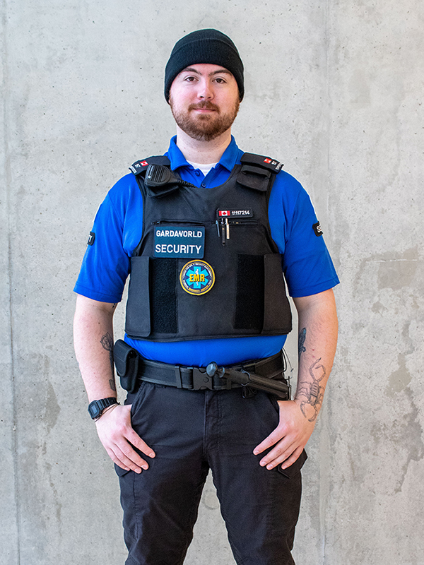 A staff member wearing the blue shift supervisor uniform.