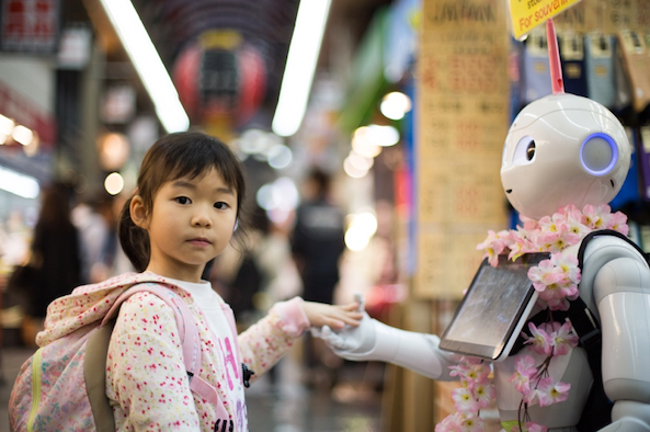Child and Robot handshake