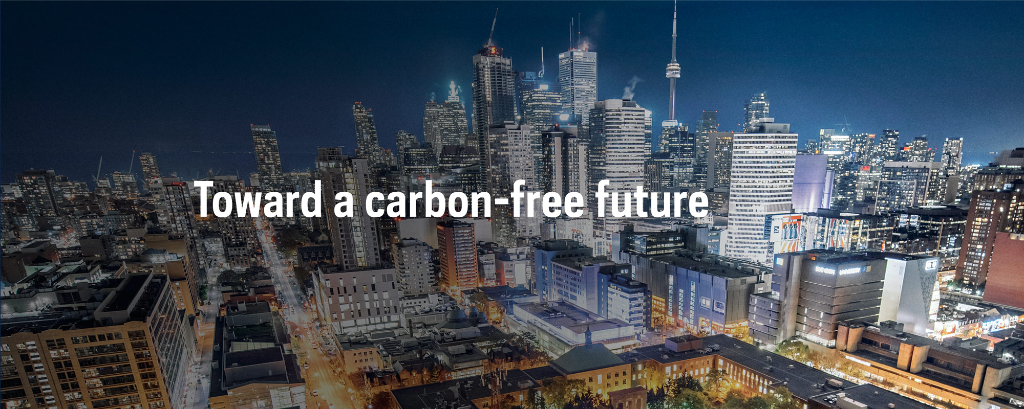 Toward a carbon-free future; Toronto cityline at night