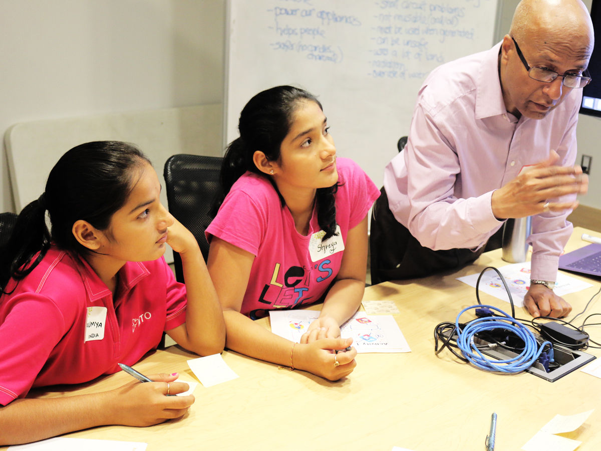 Research Fellow Bob Singh guides STEM girls through workshop. 