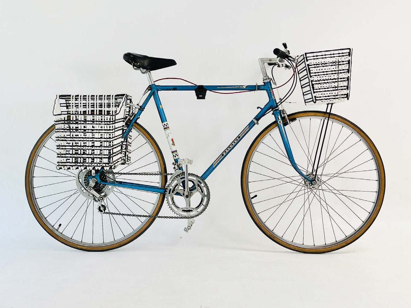 A side-view of a bicycle with a front basket and a pair of rear baskets.