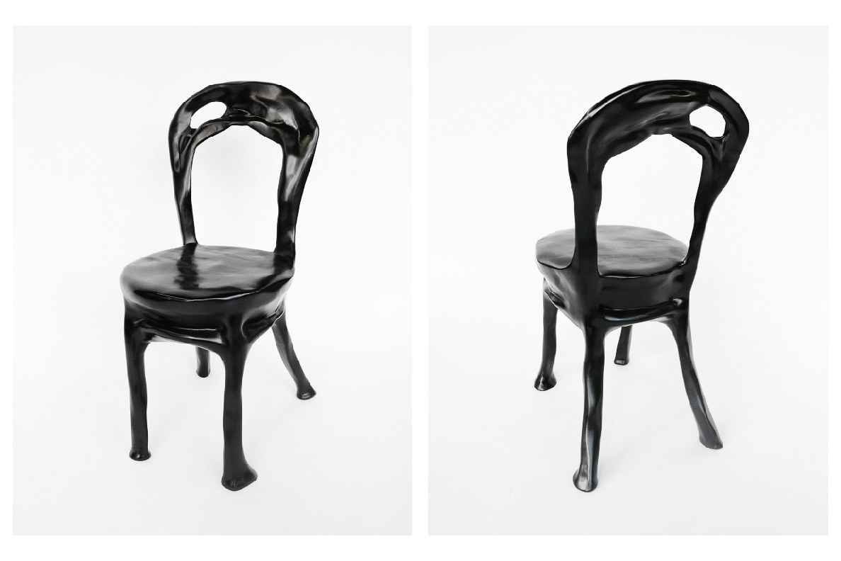 A glossy black chair with warbled surface texture. 