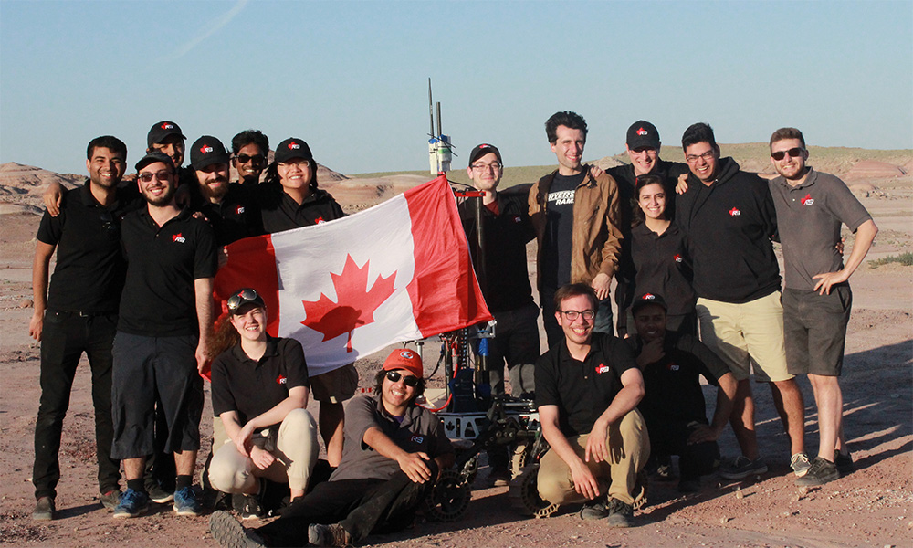 The Ryerson Rams Robotics team posing by their Mars rover