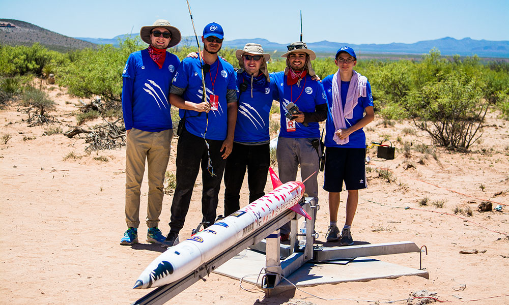 The Ryerson Rocketry team posing by their rocket