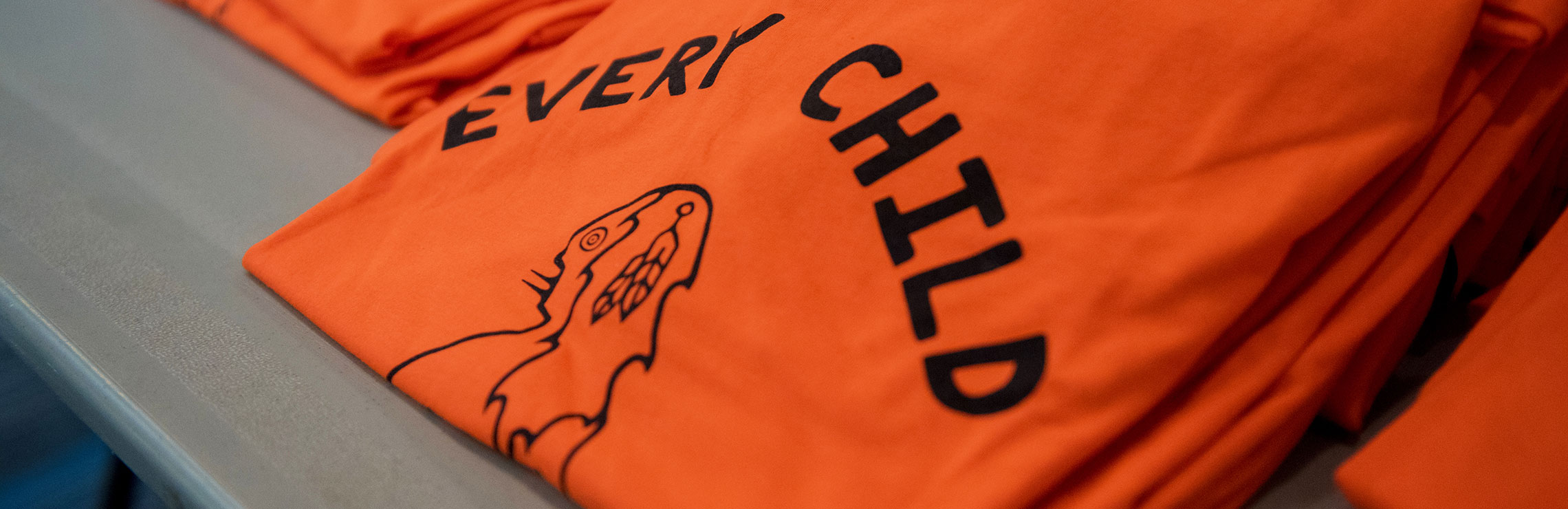 An orange t-shirt with the words, "Every child matters"