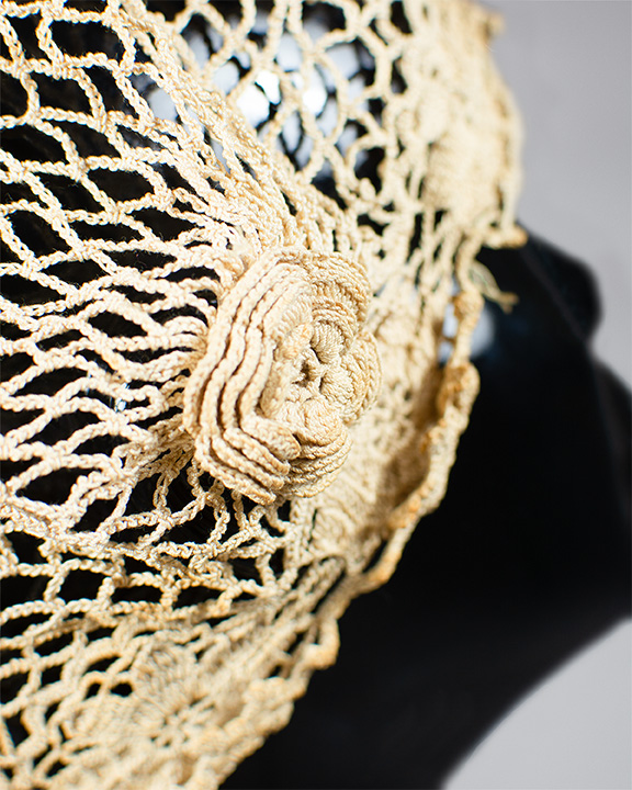 Close up of rosette detail on a 20th century boudoir cap