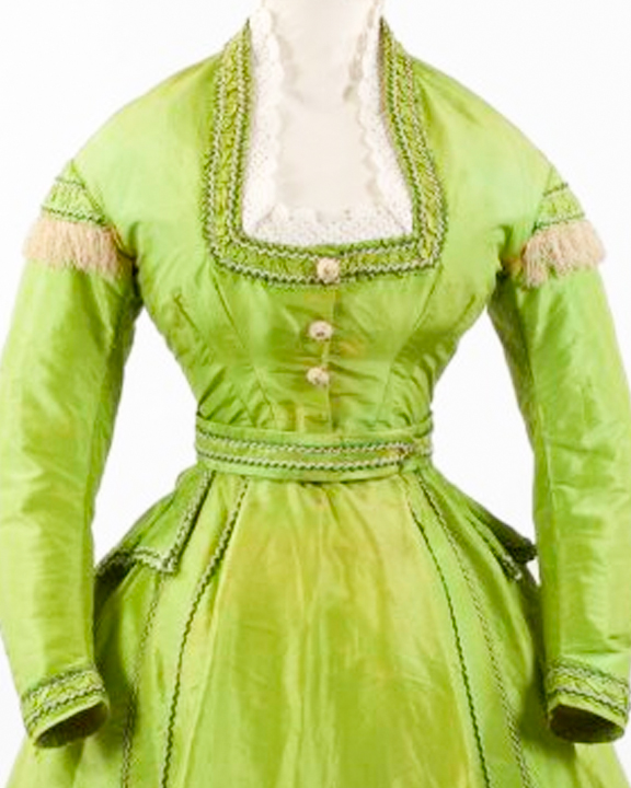 Bodice of an arsenic green dress with a square neckline and gold buttons