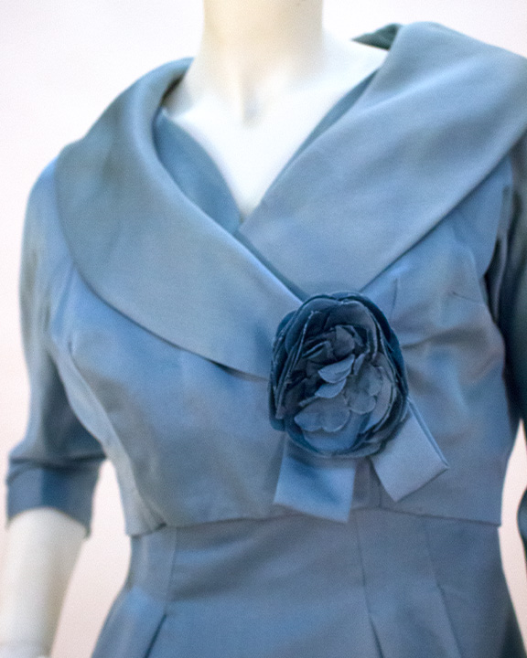 Close up of rosette detail on blue Jack Liebman dress