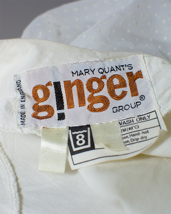 Label of a Mary Quant mini dress which reads "Mary Quant's Ginger Group, Made in England"