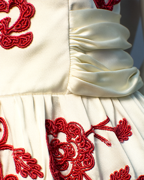 Close up of red floral detail on Julian Rose dress