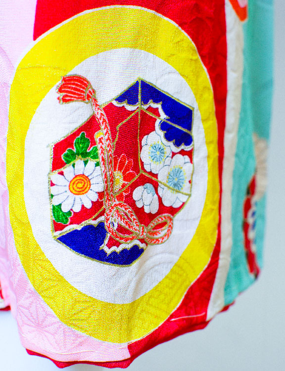 Detail of red and pink patterned kimono