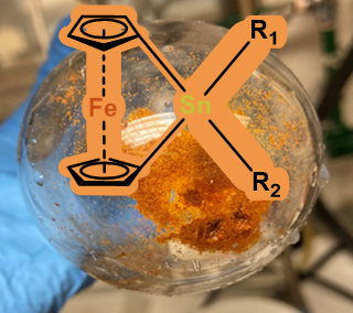 An orange powder and ChemDraw of a ferrocenyl stannane