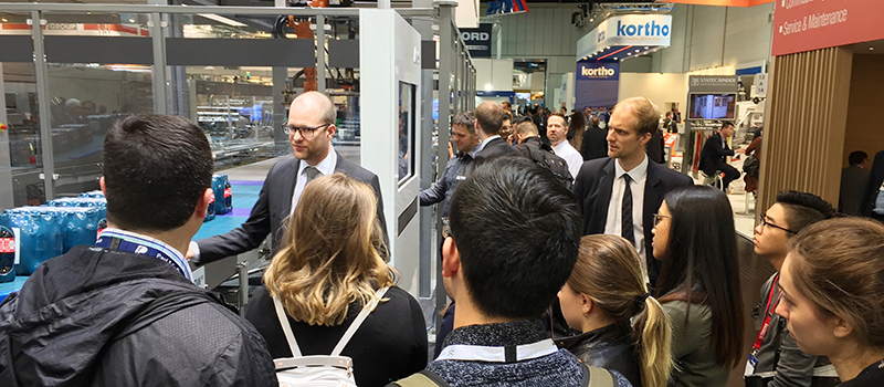 Students interacting with industry at the Interpack tradeshow