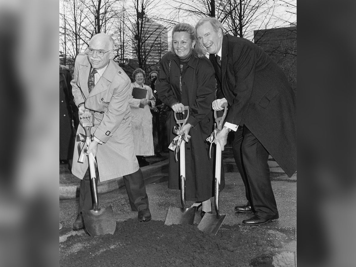Loretta (centre) and Ted (right) pose with shovels for the ceremonial breaking ground of a new building. (Photograph Courtesy of Toronto Metropolitan University Archives)