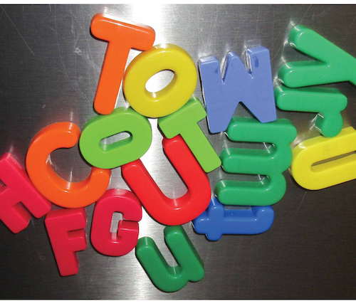Colourful magnet letters on a fridge