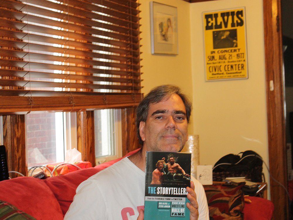 RSJ alum Greg Oliver with one of his books