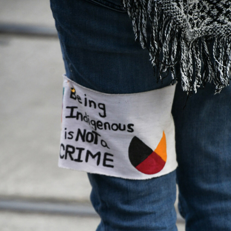 A symbols of Indigenous strength and resilience at a protest on an armband