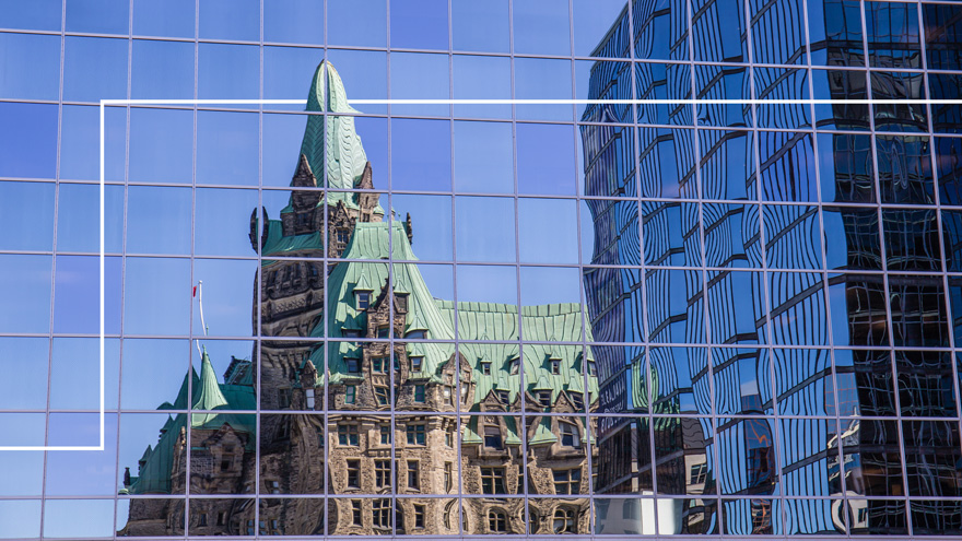 reflection of government building in windows