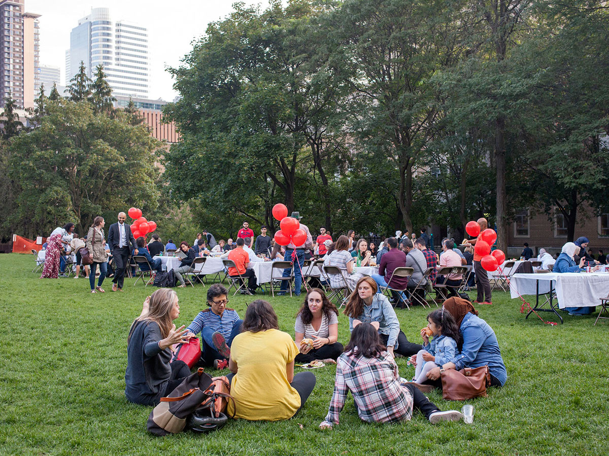 People sitting on the grass in a circle