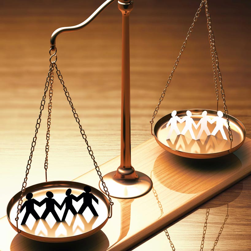 Scales of justice with cutouts of human figures