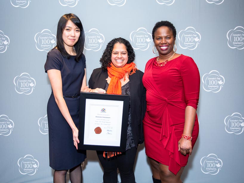 From left: Kristina Leung presenting Toni De Mello, centre, and Dayo Kefentse, far right, with Canada’s Best Diversity Employers Award