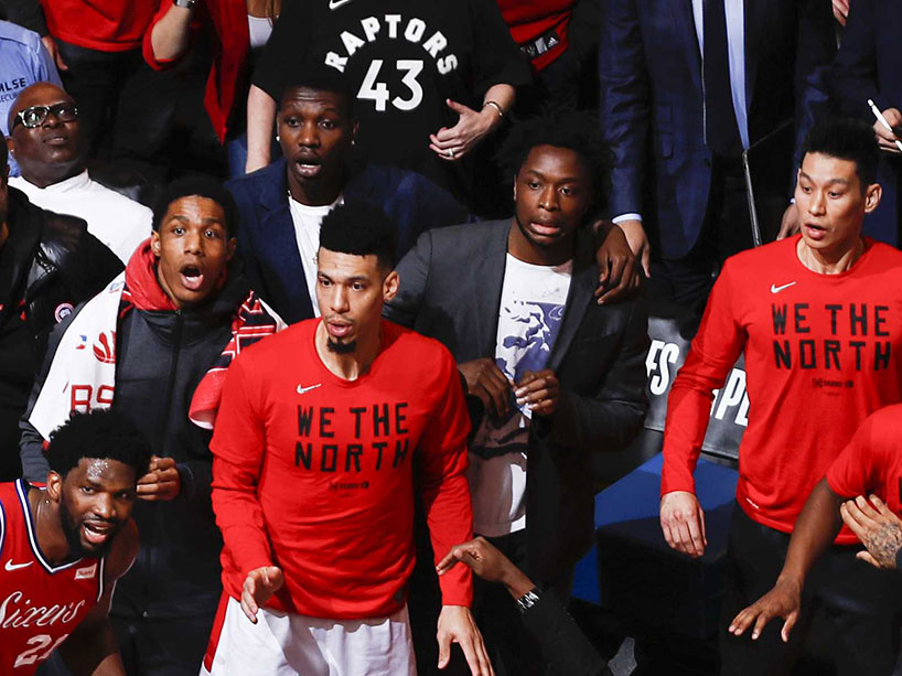 Close up of Raptors team players watching the final basket go in