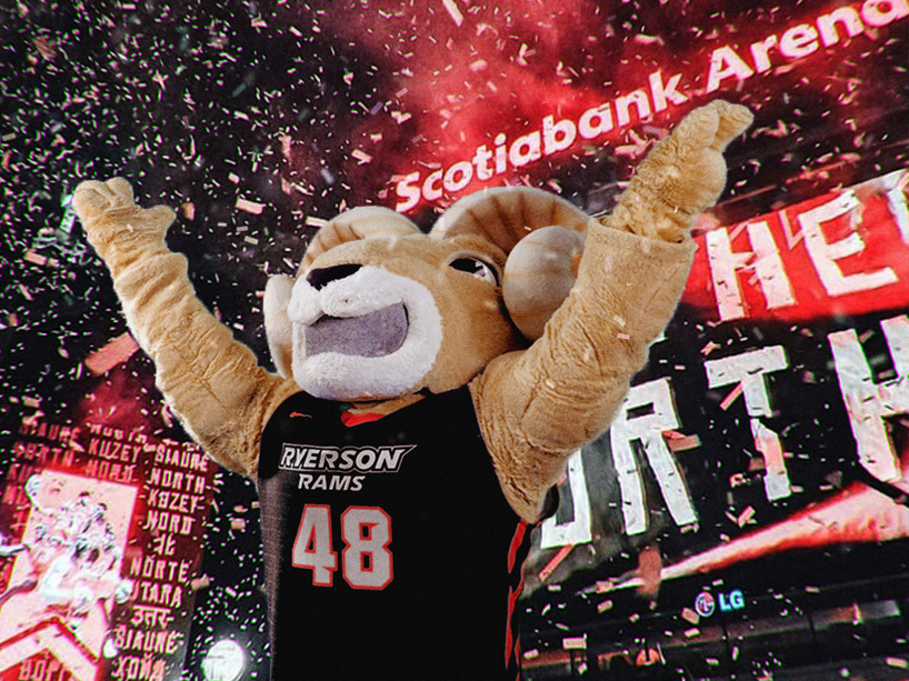 Eggy the Ram holding his arms up in the air, celebrating the Raptors winning the NBA championship