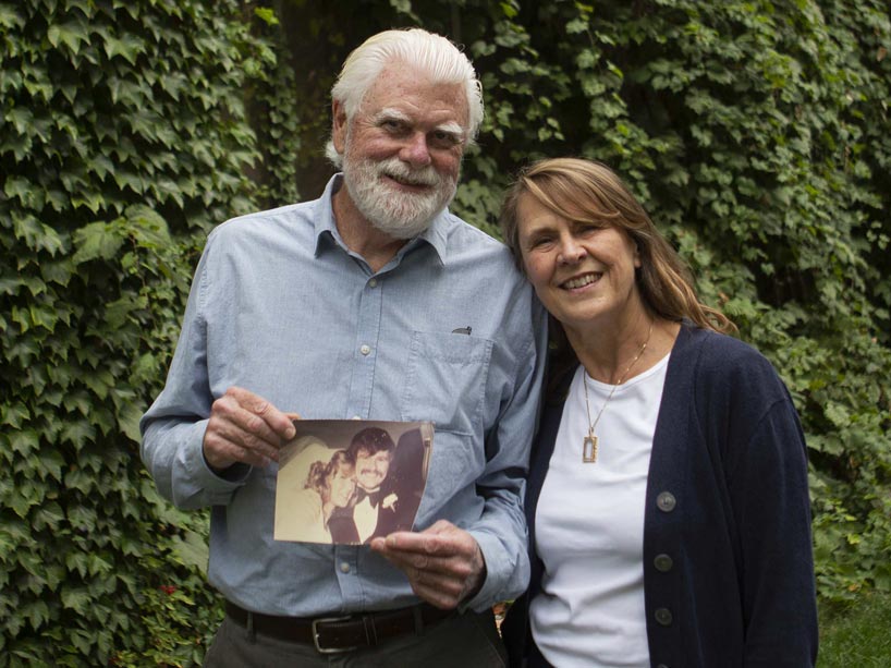 From left: Peter and Carol Helston holding their wedding photo