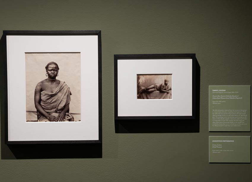 Two black and white, framed images, side by side of African women in each photo