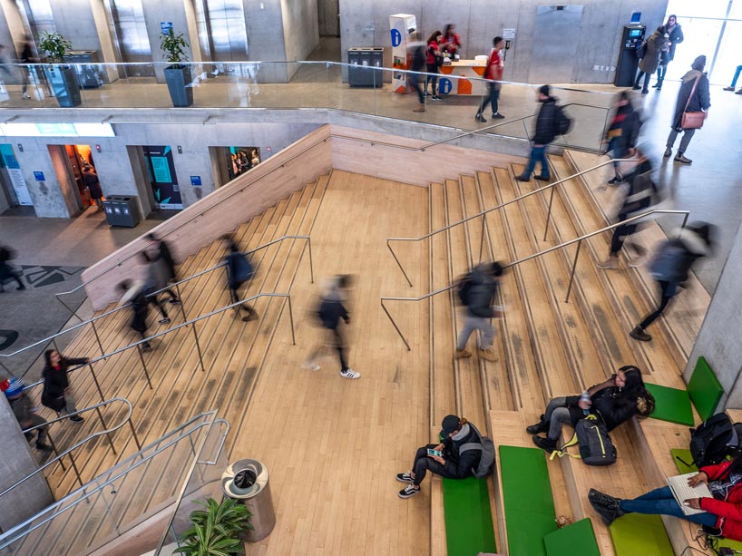 Students walking up stairs in Student Learning Centre