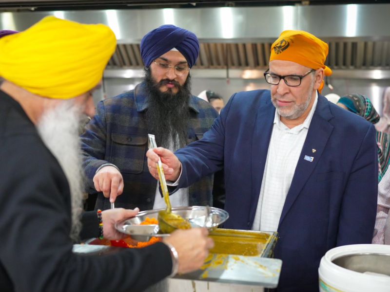 President Lachemi serving food at the Gurdwara Guru Nanak Mission Centre Brampton.