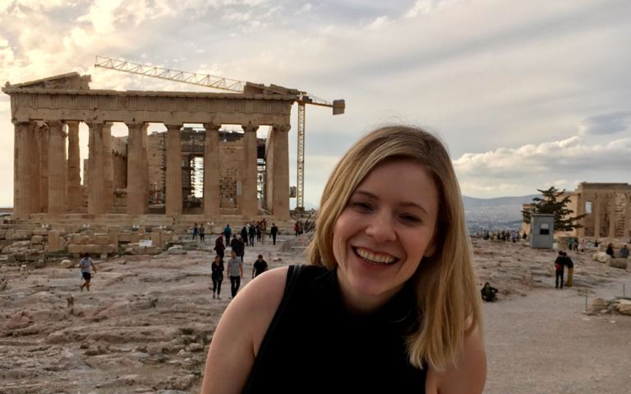 Annie Williams smiling in the foreground, with the Pantheon in background.