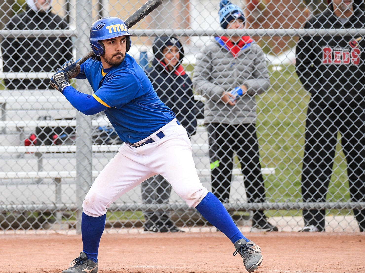 Ryerson Rams baseball player about to throw the ball.