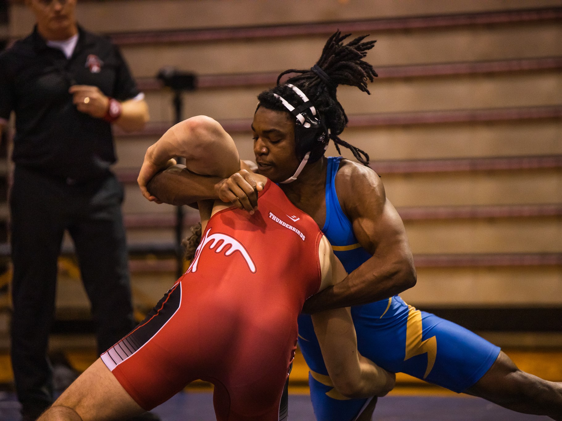 Two Rams wrestlers during a match.
