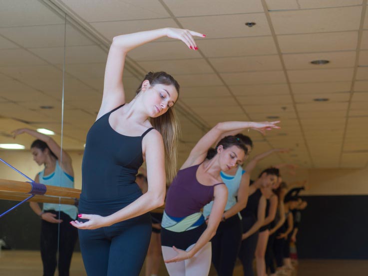 A ballet class at the barre.