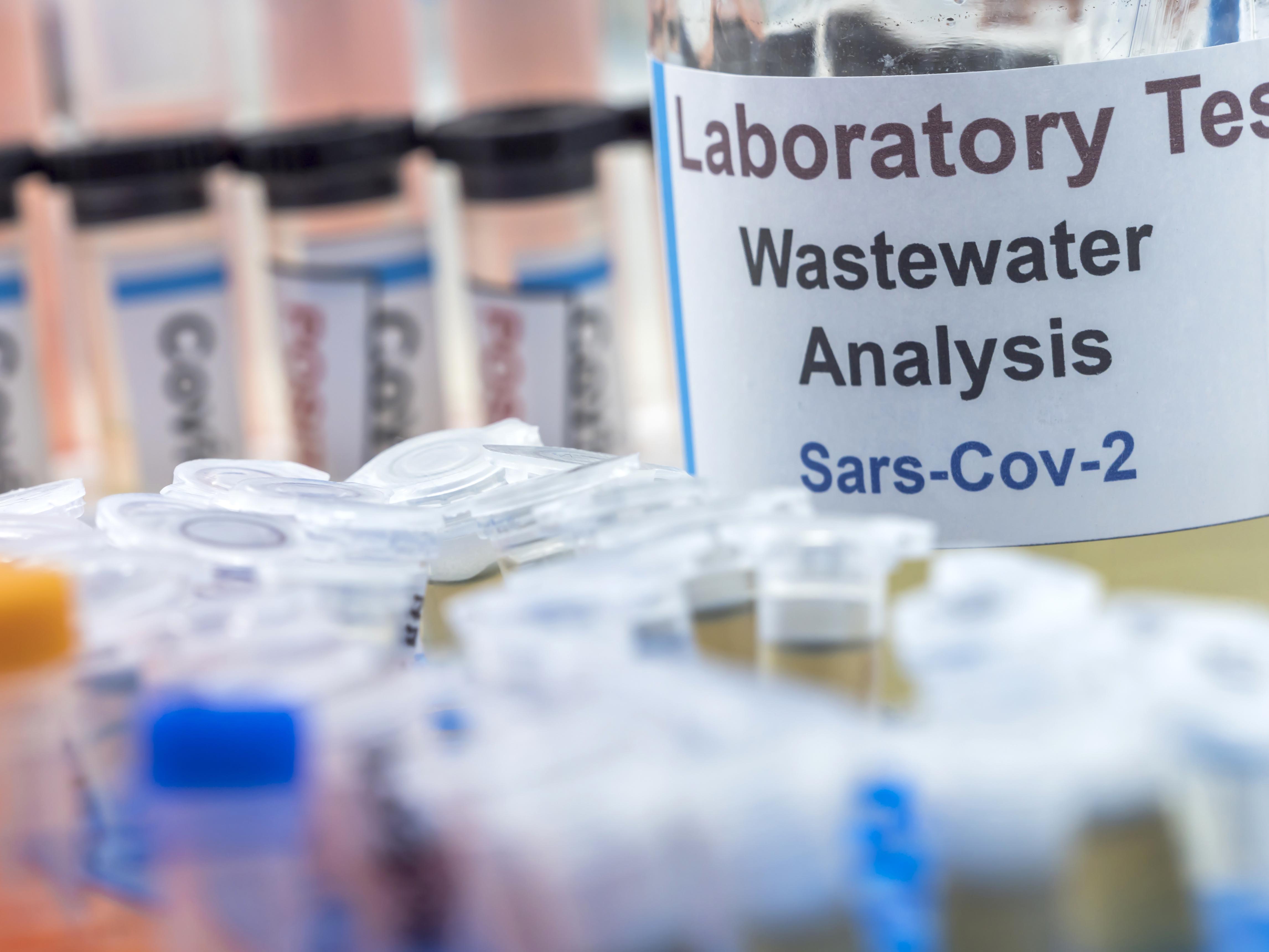 Small bottle of wastewater with label stating "Laboratory test, wastewater analysis, SARS-Cov-2"